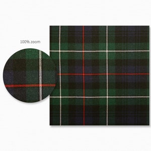 May include: A green, blue, red, and white plaid fabric with a repeating pattern.