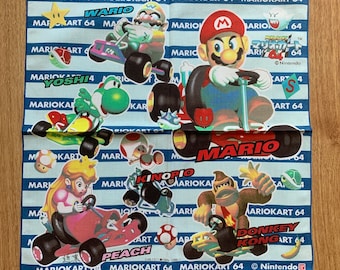 May include: A blue and white bandana with a Mario Kart 64 theme. It features images of Mario, Luigi, Peach, Donkey Kong, Yoshi, and Wario. The bandana has the text "Mario Kart 64" repeated multiple times and the Nintendo logo.