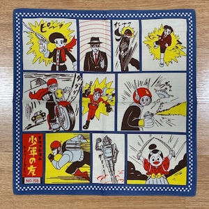May include: Square cotton handkerchief with a blue border and a comic strip design. The comic strip features various action scenes with characters in action poses, including a motorcycle, robots, and figures with weapons. The text "NO.158" is visible.