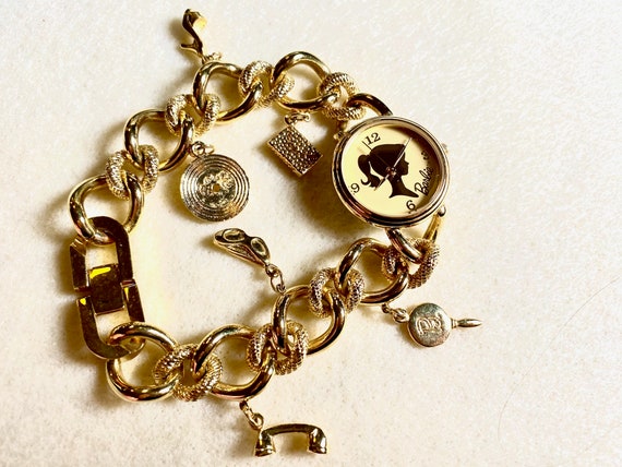Charming Barbie Fossil gold charm bracelet watch