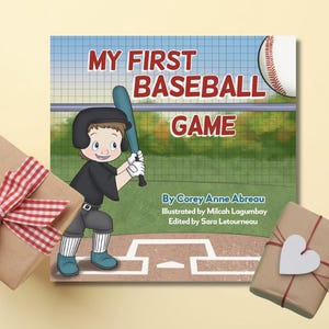 May include: A children's book titled "MY FIRST BASEBALL GAME" features a cartoon illustration of a young baseball player. The book is surrounded by two wrapped gifts, one with a red and white checkered bow and the other with a white heart.