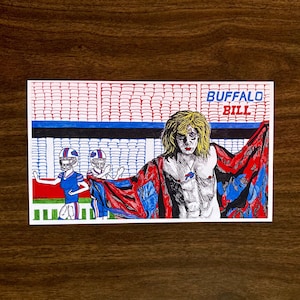 May include: A hand-drawn illustration of a man with long blonde hair wearing a red and blue robe with the text "BUFFALO BILL" above him. Two football players in blue and white uniforms are in the background.