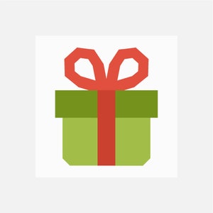 Pode incluir: Uma caixa de presente verde com um laço vermelho.