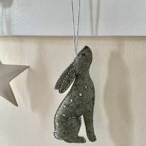 Moon gazing hare folk art hanging felt ornament, hand made and hand embroidered designed with my original artwork