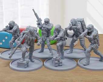 May include: Six gray plastic miniature figures of soldiers wearing futuristic armor and holding weapons. The figures are standing on round bases.