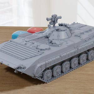 May include: A light gray, unpainted scale model of an infantry fighting vehicle featuring a turret with a mounted weapon system, detailed hull plating, and multiple road wheels with tracks. The model is presented in a matte finish.