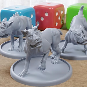 May include: Three gray dog figurines on round bases, posed in a menacing stance, are displayed with colorful dice in the background. The dice are blue, red, green, and white.