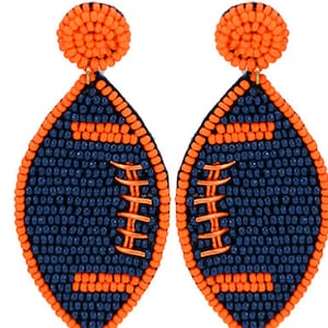 Voetbaloorbellen met blauwe en oranje kralen