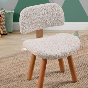 Cozy kids Sherpa chair, perfect for snuggles and relaxation. Plush, soft, and inviting, a comfy addition to any child's room or play area.