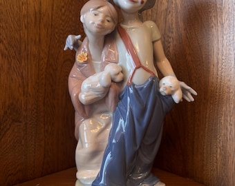 リヤドロのフィギュア「Pals Forever」ピエロと犬たちと少女 1999年