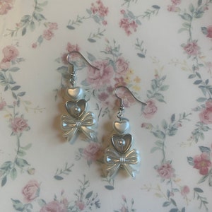 dance on my own   |    pearl bow heart dangle earring