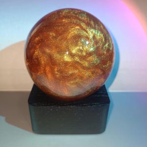 Magic Snow Globe Pearl chameleon. Glass globe. from Ukraine. Black wood base.