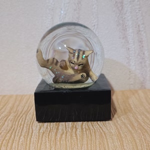 Snow globe &quot;The cat washes&quot;. from Ukraine.