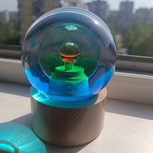 Magic Snow globe Planet Earth. Glas globe, water globe.
