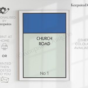 May include: A rectangular wall art print featuring a blue horizontal bar at the top and a light grey background below. The text CHURCH ROAD is printed in black in the centre, with No 1 printed in black at the bottom, all enclosed in a thin black border.