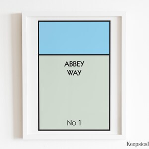 May include: A framed wall art print featuring a rectangular design with a light blue top section and a light grey bottom section. The text ABBEY WAY is printed in black in the centre, with No 1 printed in black at the bottom of the grey area.