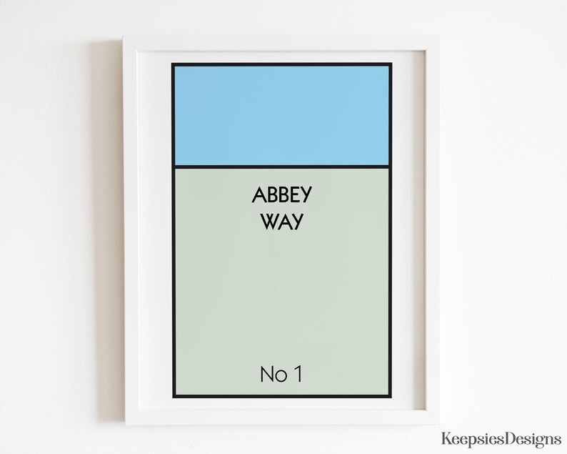 May include: A framed wall art print featuring a rectangular design with a light blue top section and a light grey bottom section. The text ABBEY WAY is printed in black in the centre, with No 1 printed in black at the bottom of the grey area.