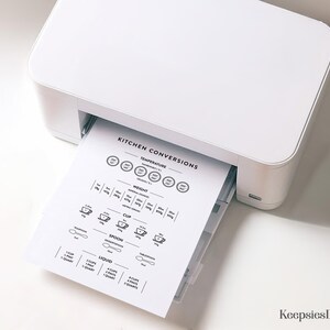 May include: A white printer printing a black and white kitchen conversions chart. The chart includes conversions for temperature, weight, cup, spoon, and liquid measurements. The chart is printed on white paper.