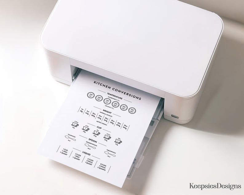 May include: A white printer printing a black and white kitchen conversions chart. The chart includes conversions for temperature, weight, cup, spoon, and liquid measurements. The chart is printed on white paper.