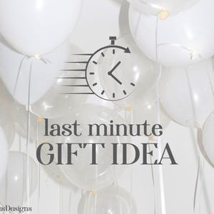 May include: White balloons fill the frame, some opaque and others transparent. A black clock graphic with a speeding arrow is centered above the words "last minute GIFT IDEA" in a dark gray font. The text "KeepsiesDesigns" is in the bottom left corner.