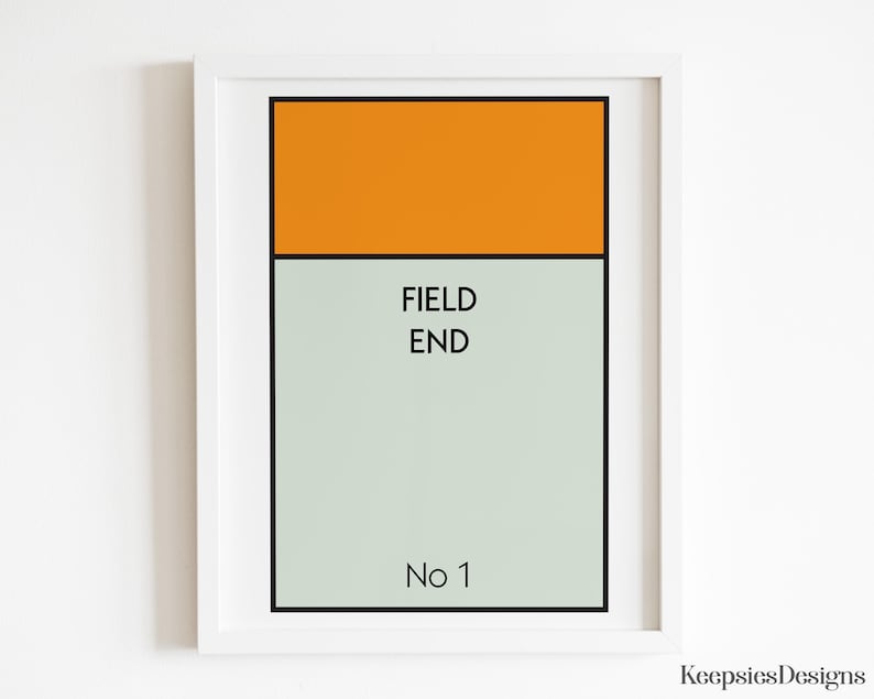 May include: A framed rectangular print featuring a solid orange horizontal bar at the top, followed by a light grey section containing the black text FIELD END and the text No 1 at the bottom, all enclosed within a simple white frame.