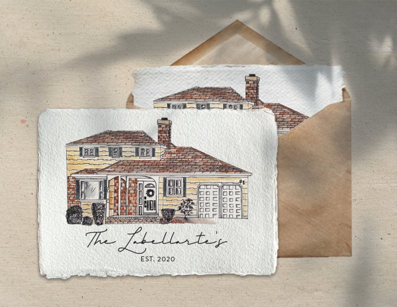 May include: A watercolour illustration of a house with a brown roof, yellow siding, and a brick chimney. The house has a front porch with a wreath on the door and two bushes in front. The text "The Labella's Est. 2020" is written below the house.