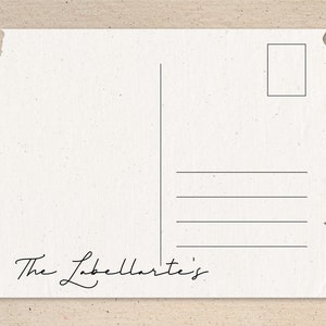 May include: A blank white postcard with a torn edge and a black stamp area. The text "The Labellaarte's" is written in cursive at the bottom.