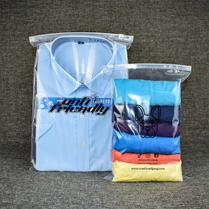 ロゴが印刷された衣類、下着、おもちゃ、化粧品の小売包装用のカスタムクリアジップシールプラスチックバッグ、カスタム衣類梱包バッグ