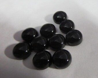 Ônix preto AAA AAA, cabochão redondo, 11 x 11 mm, gema solta.
