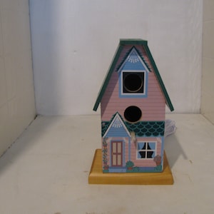 lamp home made from a little bird house i got at a yard sale.It was cute so we figured we could make a nice lamp out of it.