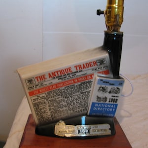 Antique Trader old newspaper.A replica from a jim beam decanter.