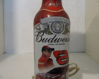 Dale Ernhart jr #8 recycled Budweiser bottle 22 oz.On a cedar base, has a little car with it that has some trinkets with it