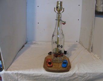 vintage bottle made into replica of racing lamp