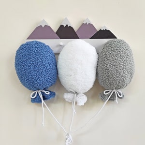 Palloncino in tessuto bouclé: decorazione da parete per la cameretta del bambino