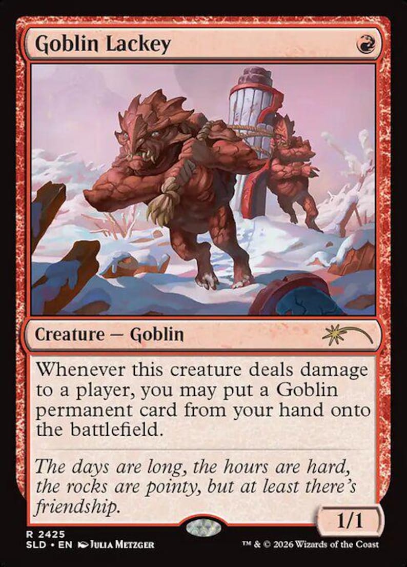 May include: A red Magic: The Gathering card named "Goblin Lackey." The card depicts a red goblin-like creature in a snowy scene, carrying a structure. Text on the card details the creature's abilities and flavour text about friendship.