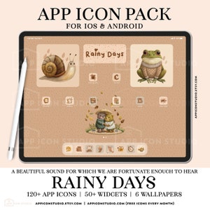 May include: A tablet screen showcases a "Rainy Days" app icon pack with illustrations of a snail, frog, and bears. The display includes text: "120+ APP ICONS | 50+ WIDGETS | 6 WALLPAPERS" and "APP ICON PACK FOR IOS & ANDROID". The background is a warm beige.