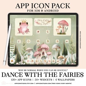 May include: A digital tablet displaying an app icon pack with a fairy-themed interface. The screen features a pink frog with a crown, mushrooms, and text reading Fairy Lights and Cozy Nights. Below, a mushroom house sits among forest plants.