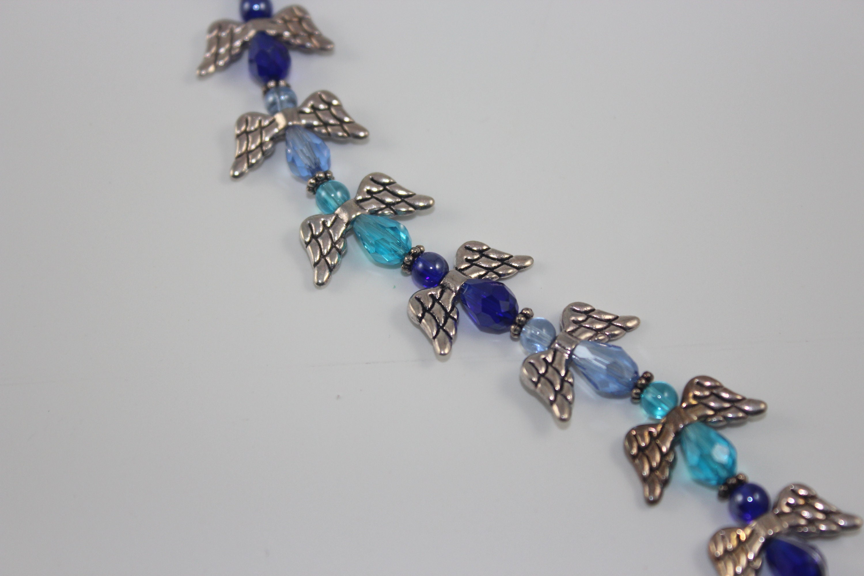 multiple lots of crystal angel beads