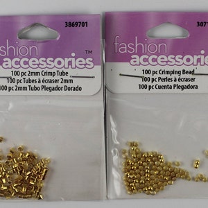 lot of small gold-tone crimp beads and tubes