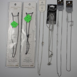 lot of silver-tone necklaces