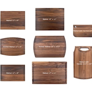 May include: A set of nine walnut wood cutting boards in various sizes and shapes. The boards include a standard rectangular shape, an arched shape, and a shape with a handle. The boards are all made of natural walnut wood and have a rich brown color.