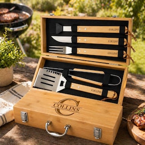 May include: A bamboo barbecue tool set with stainless steel tools and wooden handles, presented in a wooden case. The case is engraved with the name "COLLINS". The set includes a spatula, tongs, fork, knife, and basting brush.