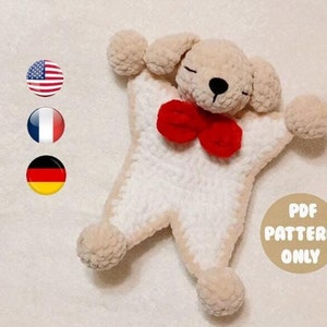 May include: Crochet pattern for a plush dog toy with a red bow. The pattern is available in PDF format only. The pattern is available in English, French, and German.