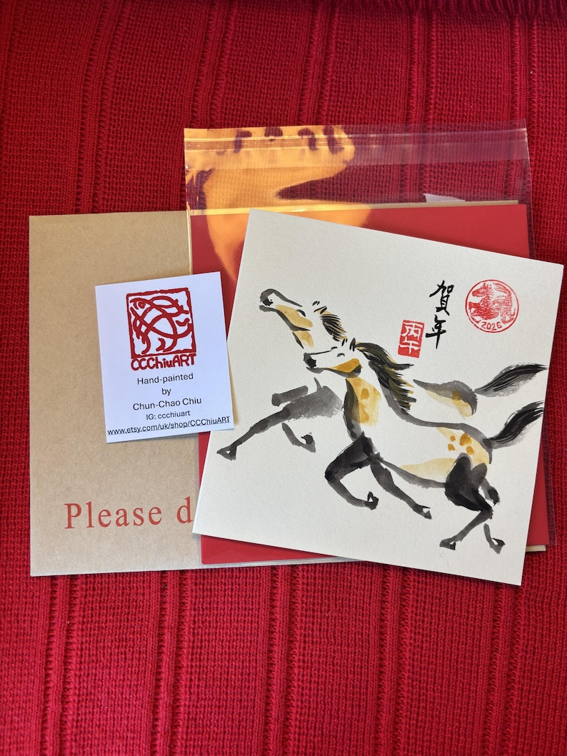 May include: Hand-painted artwork by Chun-Chao Chiu featuring two running horses in black and yellow ink. The artwork includes Chinese characters and a red seal. The image also shows a business card and a kraft paper envelope.