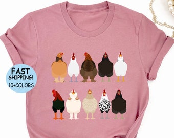 Puede incluir: Camiseta color malva con un gráfico de una línea de pollos. El texto "FAST SHIPPING! 10+ COLORS" está en un círculo azul en la esquina superior izquierda.