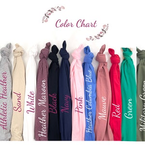 May include: Color chart showing 14 different t-shirt colors, including heather dark gray, athletic heather, sand, white, heather maroon, black, navy, pink, heather columbia blue, mauve, red, green, military green, and ice blue.