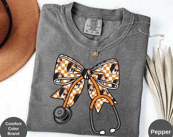 Comfort Colors TN Checkered Fall Nurse Shirt: Coquette Stethoscope Bow Game Day Tee