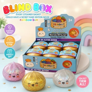 May include: A display of "Blind Box" toys featuring glittery, squishy, rainbow bun-shaped figures. The packaging includes text like "Mystery?" and "Squishy Fidget Fun!" with a "Collect Them All!" message. The boxes are labeled "One Set Glitter Edition."