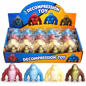 May include: A display box filled with colorful gorilla-shaped decompression toys. The toys are in various colors, including red, blue, yellow, and brown. The box has the words "DECOMPRESSION TOY" printed on it.