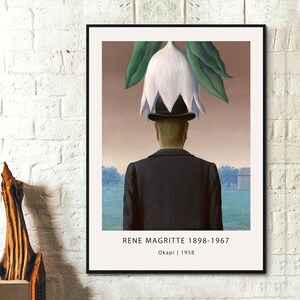 May include: A surrealist painting by Rene Magritte titled "Okapi" from 1958. A man in a suit and bowler hat is standing with his back to the viewer. A large white flower is growing from the top of his head.